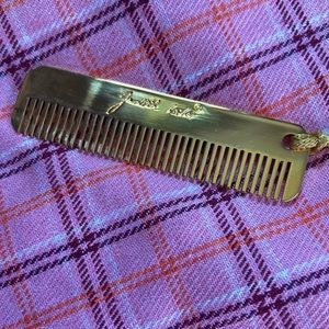 Judith Leiber gold pocket comb